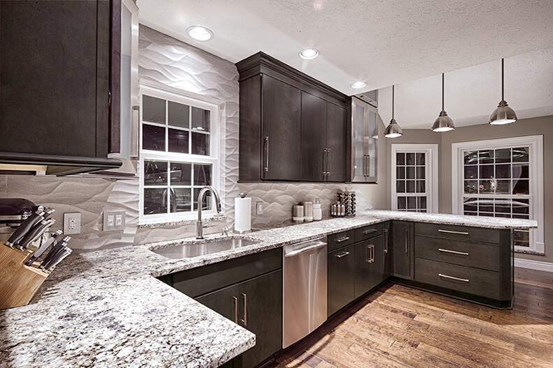 A U-Shaped kitchen design featuring Wellborn Cabinet's "Nightfall" finish.