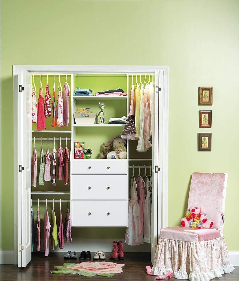 Childs closet with white cabinetry