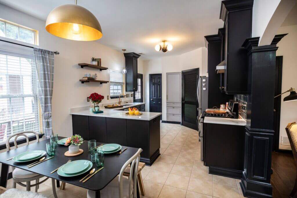 Small kitchen with black cabinets