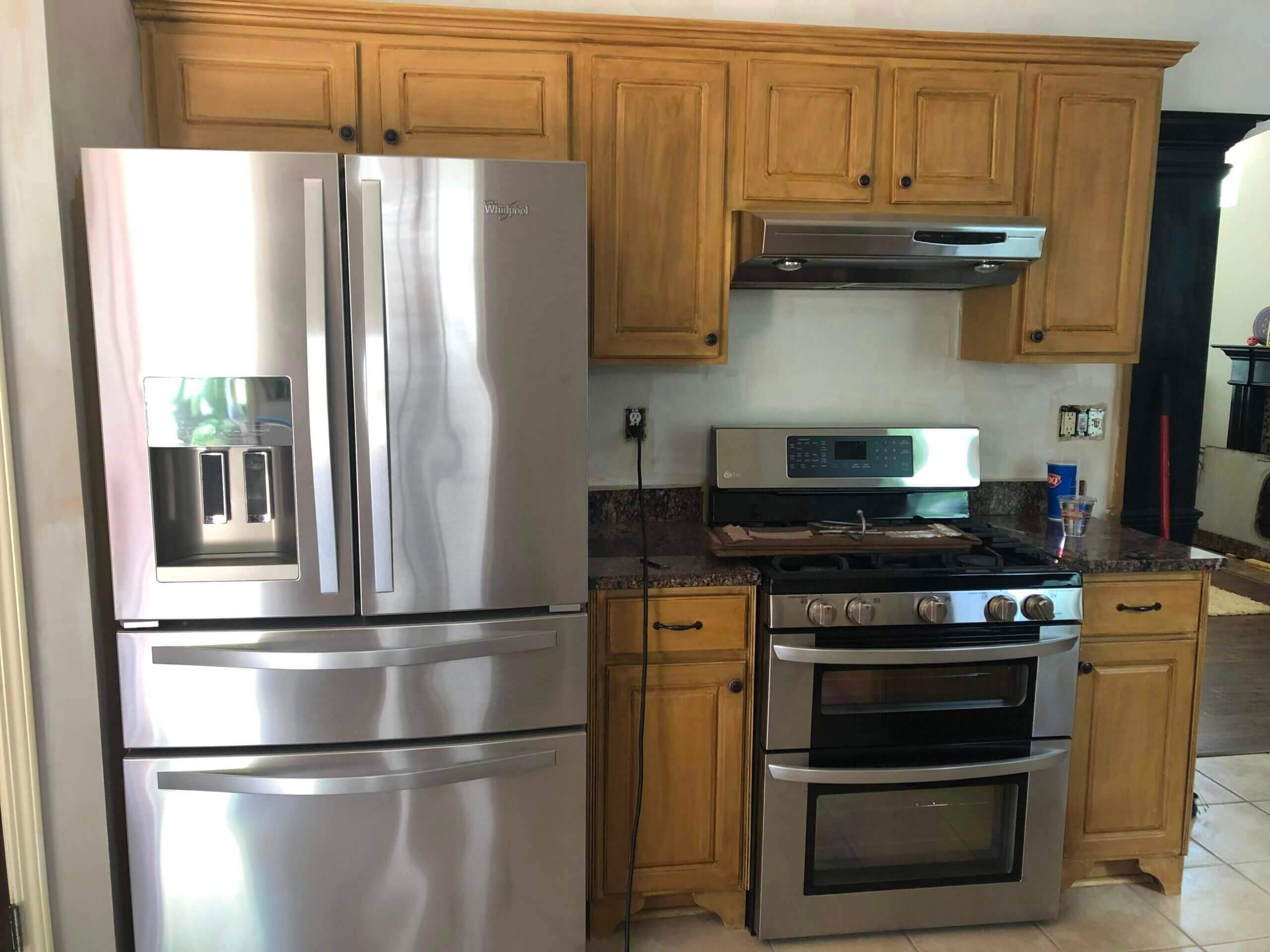 Small kitchen with natural cabinets