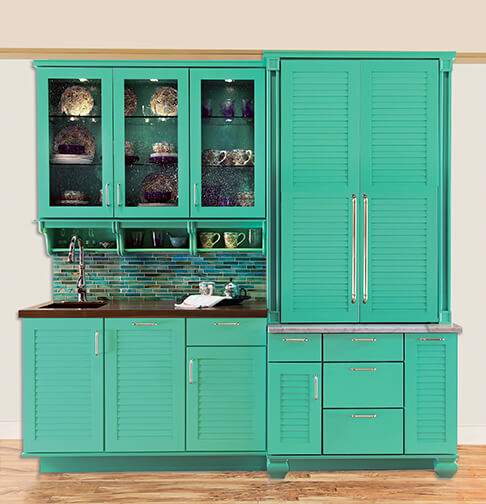 Vibrant green hutch and pantry cabinet with sink.