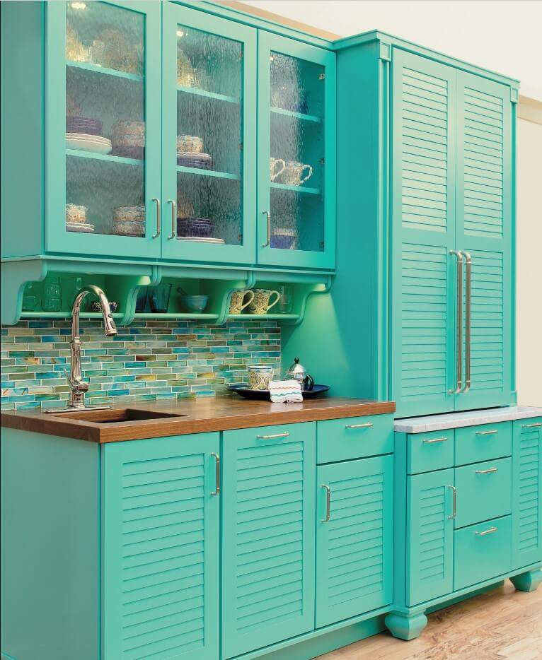 light blue color kitchen and larder cabinet with wood countertops